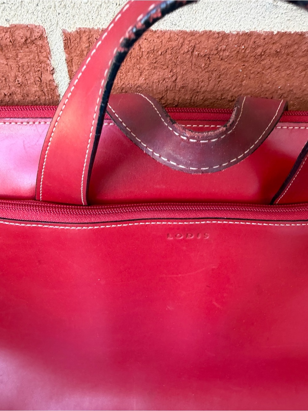 Lodis Red Leather Briefcase with Top Handles and Front Zip Pocket - Picture 2 of 3